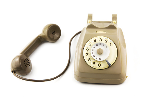 portrait of old - vintage telephone in white background
