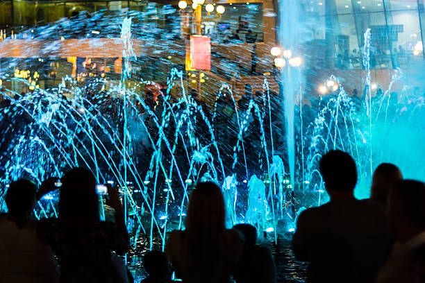 istock Fountain and people silhouettes 534133500