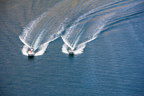 Two speedboats Two speedboats on blue Adriatic sea, Croatia fast boat stock pictures, royalty-free photos & images