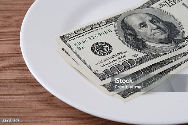 Dollar Bank Note Money In The White Plate Stock Photo - Download Image Now - 2015, Abstract, Backgrounds