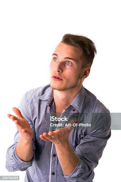 Needy Desperate Young Man Pleading Stock Photo - Download Image Now - Assistance, Dependency, Humor