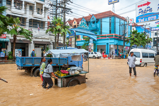 Phuket, Thailand - September 5, 2008: Floods on Thanon Ratuthit Songroipi road in Patong, Phuket. Flooding is very common during the wet season in Phuket as storm drains struggle to cope with the heavy tropical down pours