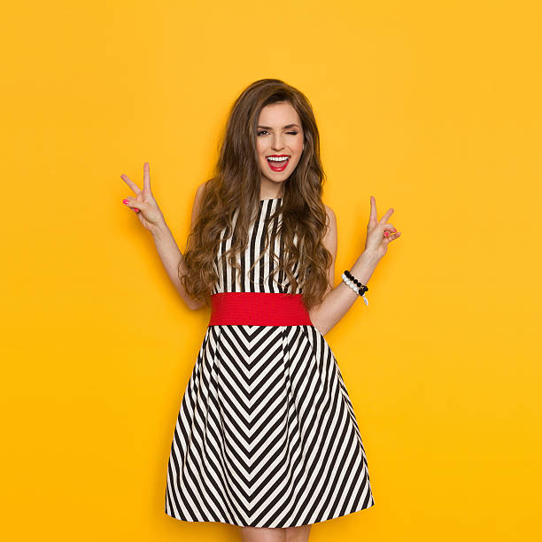 istock Winking Woman Showing Victor Hand Sign 534137426