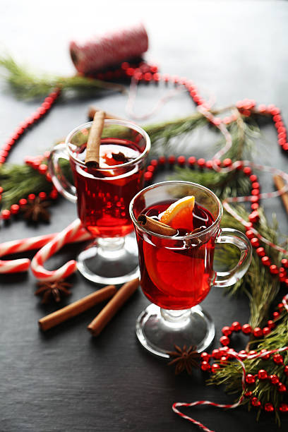 istock Mulled wine in glass on black wooden table 534137606