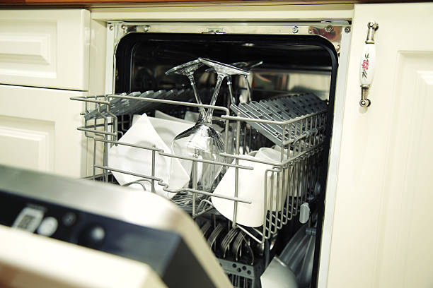 istock details of Open dishwasher with clean utensils 534138087