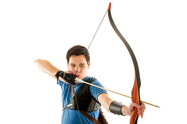 Boy shooting with a longbow stock photo