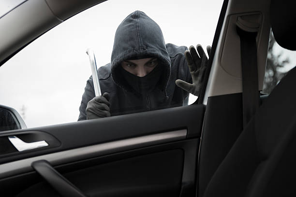 istock Thief in a mask hijacks the car 534139096
