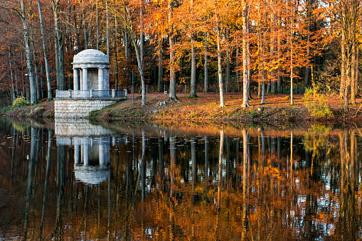 Deuss-Temple reflecting in lake - autumn in Germany, Krefeld, Stadtwald