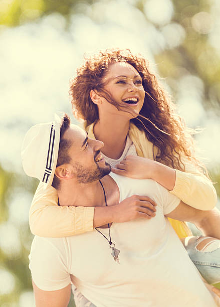 istock Young couple piggybacking outdoors. 534155985
