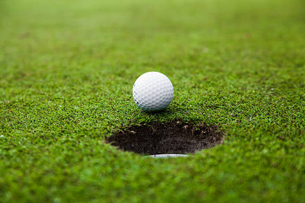istock Golf ball on green meadow. 534156871