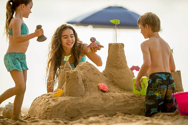 istock Family building a sand castle 534157651