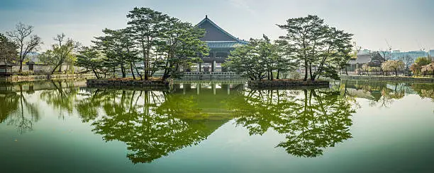 Tranquil lake reflecting the historic Gyeonghoeru Pavilion at Gyeongbokgung in the heart of downtown Seoul, South Korea. ProPhoto RGB profile for maximum color fidelity and gamut.