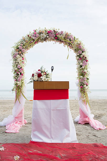 istock beach wedding set up, tropical outdoor wedding reception, beautiful cabana, wedding arch. 534158401