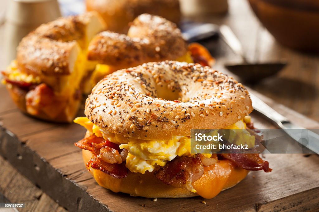 Hearty Breakfast Sandwich on a Bagel Hearty Breakfast Sandwich on a Bagel with Egg Bacon and Cheese Bagel Stock Photo