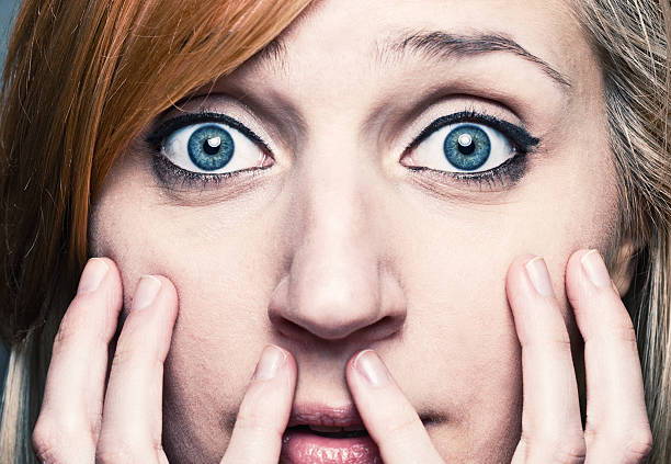 istock Bewildered young woman brings her hands at the face 534159933