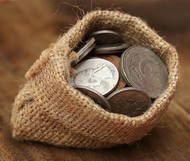 istock Old coins in sack bag 534161381