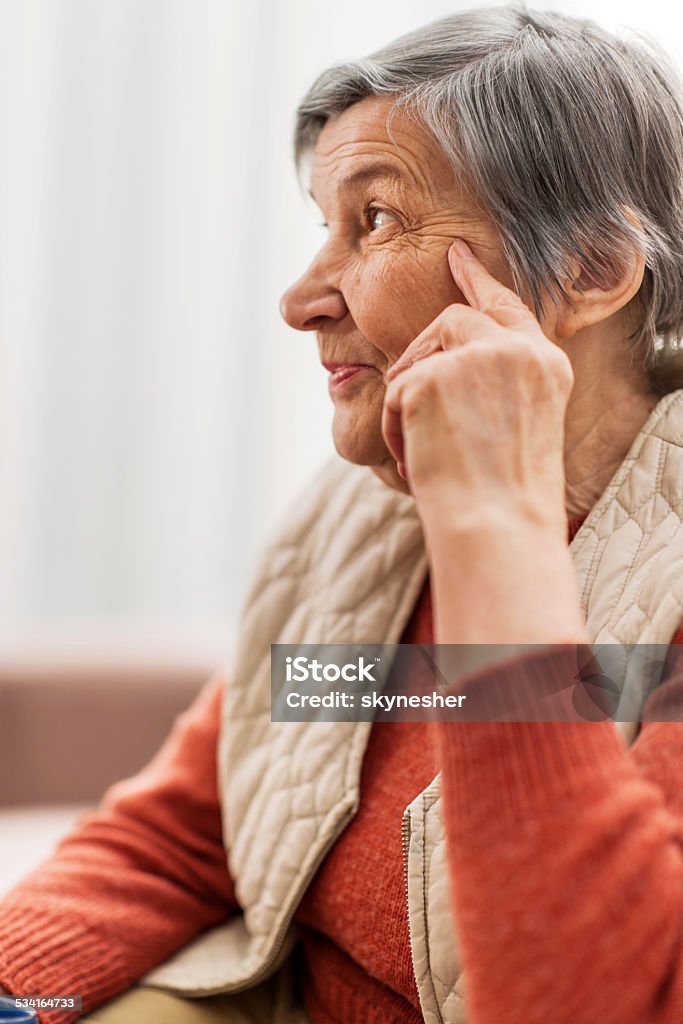 Senior woman. Side view of senior woman thinking. 2015 Stock Photo