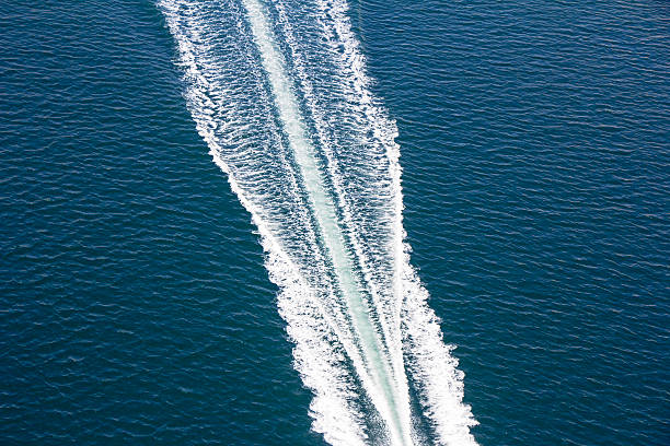 Speed boats trace Speed boats trace on the blue sea sea wake stock pictures, royalty-free photos & images