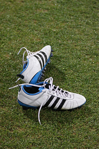 Kyiv, Ukraine - March 24, 2011: Pair of Adidas football boots on the grass