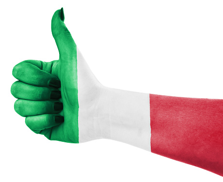 Hand is showing Italian flag to camera.