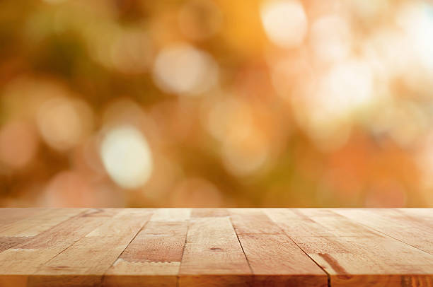 Wood table top on brown bokeh abstract background