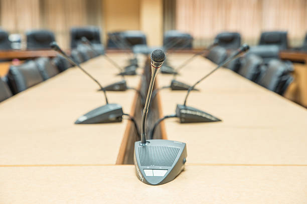 istock Before a conference, the microphones in front of empty chairs 534165953