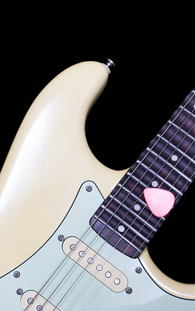 istock pink pick on scalloped mastic electric guitar fingerboard 534188697