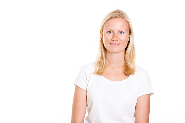istock blond young woman with freckles 534189192