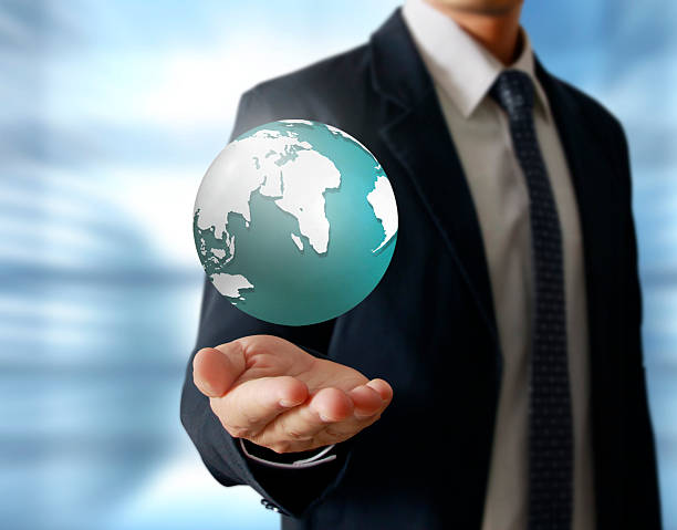 istock holding a glowing earth globe in his hands 534189547