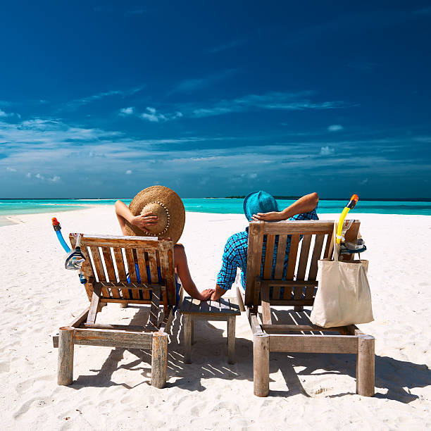 istock Couple relax on a beach at Maldives 534190115
