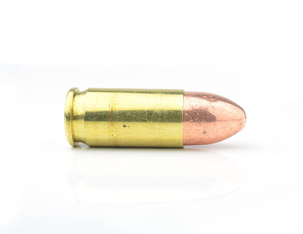 istock 9mm bullet for a gun isolated on white background. 534190125