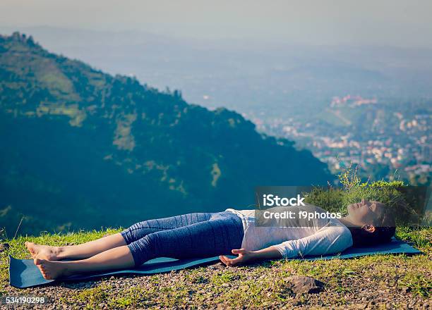 Woman Relaxes In Yoga Asana Savasana Outdoors Stock Photo - Download Image Now - Shavasana, Portrait, Active Lifestyle