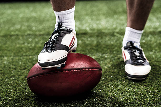 Rugby Foot of rugby player on the ball studded footwear stock pictures, royalty-free photos & images