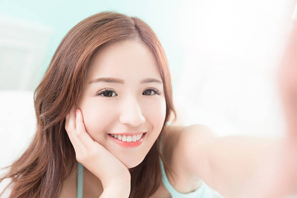 istock smile woman take a selfie 534190688