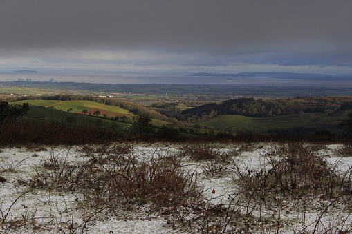 Landscape photo taken from the top of Cothelstone Hill on The Quantocks, SW England. The image was taken in winter time and the weather was cold. Snow is on the ground in the foreground.