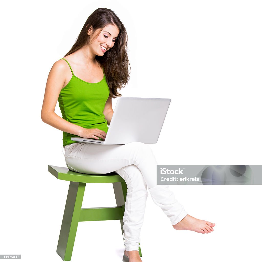 Working at home with a laptop Beautiful woman sitting in a chair working with a laptop, isolated over a whiteBeautiful woman sitting in the floor working with a laptop, isolated over a whiteBeautiful woman sitting in a chair working with a laptop, isolated over a whiteBeautiful woman sitting in the floor working with a laptop, isolated over a white 2015 Stock Photo