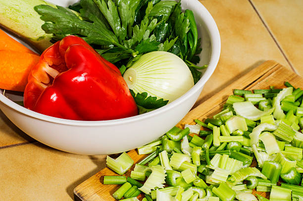 Fresh vegetables for soup, sliced celery, red pepper, zucchini, onions, carrots. Delicious raw vegetables.