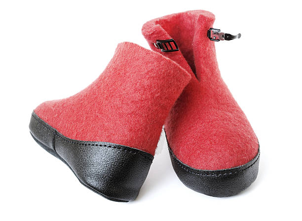 istock Pair of felt boots bright red color 534193362
