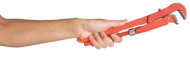 istock Female hand holding gas wrench 534194933