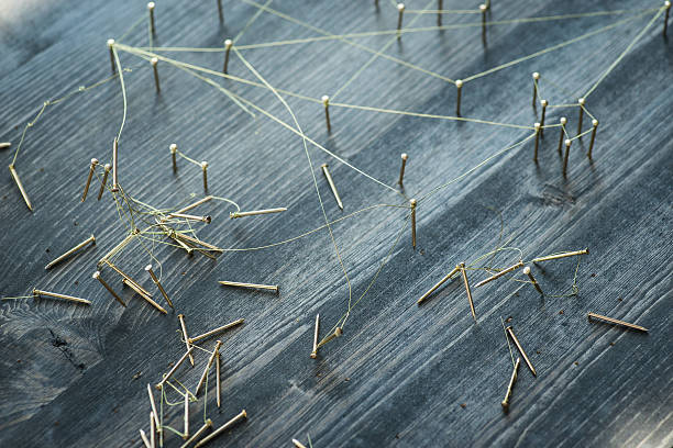 istock Web of wires, showing broken connections between groups and singles 534196550
