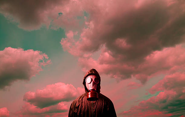 Gas mask Man wearing a gas mask on his face. biochemical weapon photos stock pictures, royalty-free photos & images