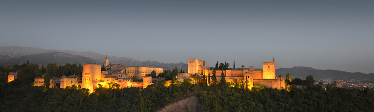 The Alhambra, in Granada, Spain at twilight. Evening panorama