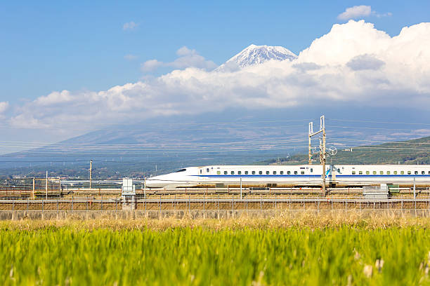 Shinkansen Fuji Shizuoka, Japan - December 1, 2015: Shinkansen bullet train with Mt. Fuji landscape in Shizuoka ,Japan on DEC 1 ,2015. Shinkansen is world's busiest high-speed railway operated by four Japan Railways companies. bullet train mount fuji stock pictures, royalty-free photos & images