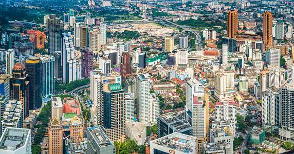 Aerial view over the skyscrapers and crowded cityscape of Bukit Bintang in the heart of downtown Kuala Lumpur, Malaysia's vibrant capital city. ProPhoto RGB profile for maximum color fidelity and gamut.