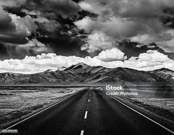 Road On Plains In Himalayas With Mountains Stock Photo - Download Image Now - Black And White, Road, Landscape - Scenery