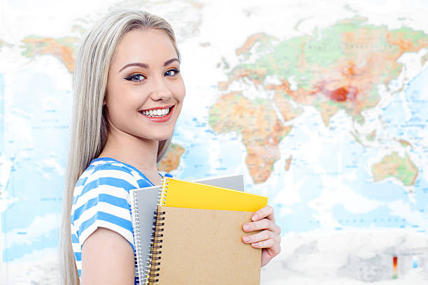 istock Beautiful young woman near map 534199736