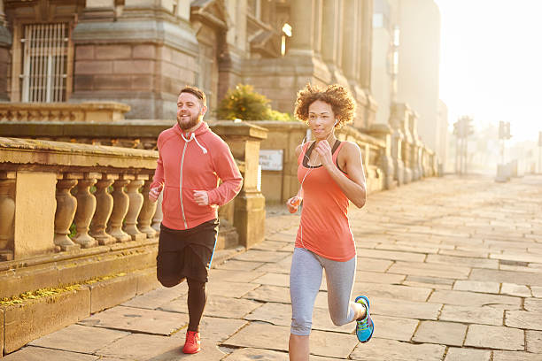 istock young couple city running 534201284