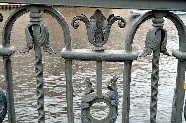 istock detail of an old bridge with decorated handrail. 534201366