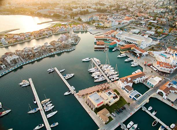 Aerial view of Limassol Marina, Cyprus Aerial view of the beautiful Marina in Limassol city in Cyprus, the beach, boats, piers, villas and commercial area. A very modern, high end and newly developed space where yachts are moored and it's perfect for a waterfront promenade. limassol stock pictures, royalty-free photos & images