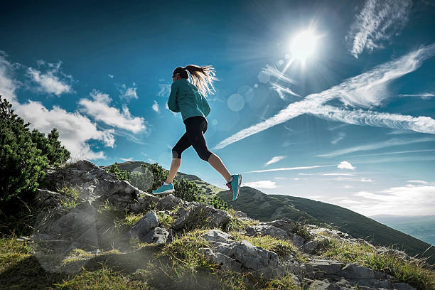 istock Female running in mountains under sunlight. 534201462